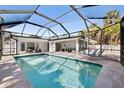 The in-ground screened pool is a refreshing backyard oasis with tile surround at 106 N Blvd Of The Presidents, Sarasota, FL 34236