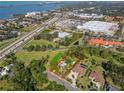 Aerial view showcasing the property's location near the water and retail area at 109 Burney Rd, Osprey, FL 34229