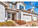 Charming townhome with a private two-car garage, manicured landscaping, and a warm, welcoming entryway at 11831 Brookside Dr, Bradenton, FL 34211