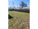 Large fenced backyard perfect for entertaining and outdoor activities, ensuring privacy and security at 1472 Nantucket Rd, Venice, FL 34293