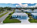 An aerial view of a community featuring well-maintained homes, lush landscaping, and coordinated architectural design at 1511 S Knollwood Dr, Bradenton, FL 34208