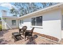 Cozy outdoor seating area with brick patio and wicker furniture, perfect for relaxing or entertaining at 317 Harbor S Dr, Venice, FL 34285