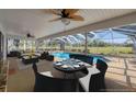 Screened-in pool area with dining set and lounge seating providing an outdoor space to relax and entertain at 3215 Pine Valley Dr, Sarasota, FL 34239