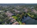 Aerial view of the community showcasing lush greenery, ponds, and well-maintained homes at 3933 Glen Oaks Manor Dr, Sarasota, FL 34232