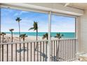 Balcony view of sandy beach and beautiful ocean waters at 4835 Gulf Of Mexico Dr # 302B, Longboat Key, FL 34228