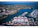Aerial view of condo complex on the water with boat docks at 501 Tamiami N Trl # 601, Venice, FL 34285