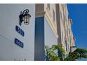 Close-up of building showing unit number and decorative lighting at 501 Tamiami N Trl # 601, Venice, FL 34285