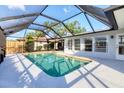 Screened pool with a glass enclosure and painted deck is perfect for relaxing and entertaining at 6722 Roxbury Dr, Sarasota, FL 34231