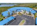 Stunning aerial view of a condo complex boasting a beautiful blue roof, manicured landscaping, and ample parking at 803 Audubon Dr # 803, Bradenton, FL 34209