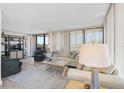 Bright and airy living room with comfortable seating, light wood floors, and natural light at 1001 Beach Rd # A203, Sarasota, FL 34242