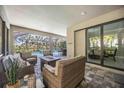 Inviting outdoor patio space with comfortable seating, a fire pit, and views of the pool at 12370 Marsh Pointe Rd, Sarasota, FL 34238