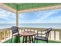 Balcony view showcasing stunning ocean scenery and clear blue skies at 2350 N Beach Rd # 1B, Englewood, FL 34223