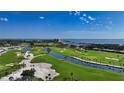 Aerial view of the golf course and water at 2425 Gulf Of Mexico Dr # 3E, Longboat Key, FL 34228