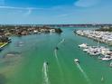 Waterfront property aerial view showcasing boat access, docks, and nearby residential community at 244 Saint Augustine Ave # 905, Venice, FL 34285