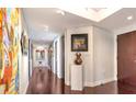 Inviting hallway with stylish hardwood floors and decorative art pieces along the walls at 401 S Palm Ave # 801, Sarasota, FL 34236