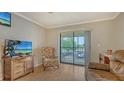 Cozy living room with natural light and a view of the balcony, perfect for relaxation and enjoyment at 503 Albee Farm Rd # B6, Venice, FL 34285