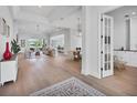 Spacious living room showcasing an open floor plan, bright natural light, and views of the pool area at 8330 Abingdon Ct, University Park, FL 34201