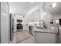 Beautiful kitchen featuring granite counters, stainless appliances, and recessed lighting at 12151 Amica Loop, Venice, FL 34293