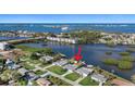 Aerial view of waterfront home, highlighting the neighborhood and waterfront access at 1230 S Maryknoll Rd, Englewood, FL 34223