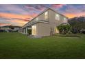 Expansive backyard showcasing lush green grass, and the home's facade at 14932 Amberjack Ter, Lakewood Ranch, FL 34202
