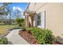 Attractive walkway with lush landscaping and mulch leading to the welcoming front door at 14932 Amberjack Ter, Lakewood Ranch, FL 34202