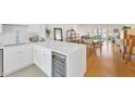 Bright, open kitchen with sleek white cabinetry, quartz countertops and stainless steel appliances at 1600 1St W Ave # 102A, Bradenton, FL 34205