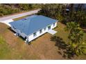 A high-definition aerial shot showcases the backyard and landscaping of this single-story home at 3807 Las Vegas Ave, North Port, FL 34288