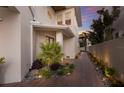 Charming home exterior with a landscaped walkway and manicured garden lighting up the path at 3916 N Shell Rd, Sarasota, FL 34242