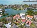 Stunning aerial of a waterfront neighborhood featuring luxurious houses and scenic water views at 4129 Roberts Point Cir, Sarasota, FL 34242