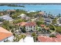 A captivating aerial view showing a waterfront home with a sparkling swimming pool at 4129 Roberts Point Cir, Sarasota, FL 34242