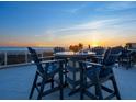 Spacious balcony provides comfortable seating with sunset views of the ocean at 534 Beach Rd, Sarasota, FL 34242