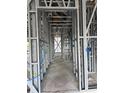 Interior framing of a building showing metal studs, wiring, and pipes running throughout at 6970 Beckwith Ave, North Port, FL 34291