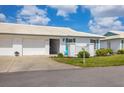 Charming single-story villa with tile roof, white exterior and a well-maintained lawn at 7402 8Th W Ave, Bradenton, FL 34209