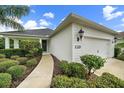 Well-maintained front exterior view of a single Gathering home with a walkway leading to the front door at 12225 Whisper Lake Dr, Bradenton, FL 34211
