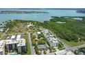 Beautiful coastal area with lush greenery, water views and modern apartment buildings at 129 Taft Dr # W102, Sarasota, FL 34236