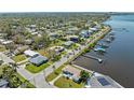 Waterfront homes with boat docks line the waterway and are surrounded by lush trees at 2014 Riverside E Dr, Bradenton, FL 34208