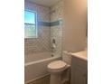 Updated bathroom showcasing subway tile surround and modern fixtures at 2020 45Th Street Ct E # A, Bradenton, FL 34208