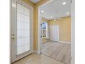 Bright bedroom with neutral walls, a ceiling fan, and light gray flooring at 4331 Turnberry Cir, North Port, FL 34288