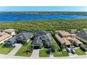 Aerial view of the single Gathering home showing a beautiful lakeside community at 5602 Tidewater Preserve Blvd, Bradenton, FL 34208
