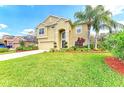 Beautiful home with lush green lawn, attractive landscaping, and mature trees under a bright sky at 8124 115Th E Ave, Parrish, FL 34219