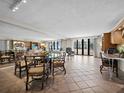 Spacious open-concept living and dining area with sliding doors that offer natural light at 1485 Gulf Of Mexico Dr # 205, Longboat Key, FL 34228