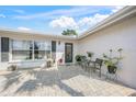 Lovely outdoor patio featuring seating, greenery, and a tranquil atmosphere at 2427 Tulip St, Sarasota, FL 34239