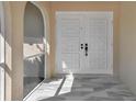 Elegant double front door with patterned design, offering a grand entrance at 2640 Geneva Rd, Venice, FL 34293