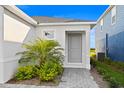 Inviting entryway with brick pavers and well-maintained landscaping leading to the front door at 3707 Ambersweet Crossing, Parrish, FL 34219