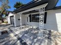 Beautiful home exterior featuring decorative columns, fresh paint, and a welcoming entryway at 4490 Indianapolis Ne St, St Petersburg, FL 33703