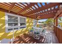 Relaxing outdoor deck with stylish patio furniture, perfect for enjoying the coastal breeze at 110 Oak Ave # A, Anna Maria, FL 34216