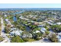 Aerial view of a waterfront community with canals and beautiful single-Gathering homes at 115 65Th Street Nw Ct, Bradenton, FL 34209