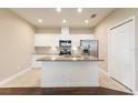 Spacious kitchen with stainless steel appliances, granite countertops, and a center island at 11936 82Nd E St, Parrish, FL 34219