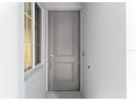 Modern gray front door with sidelight, enhancing the home's curb appeal at 12180 Wellen Golf St # 302, Venice, FL 34293