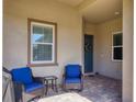 Cozy covered patio featuring comfortable seating and a view of the home's exterior at 17842 Cherished Loop, Bradenton, FL 34211